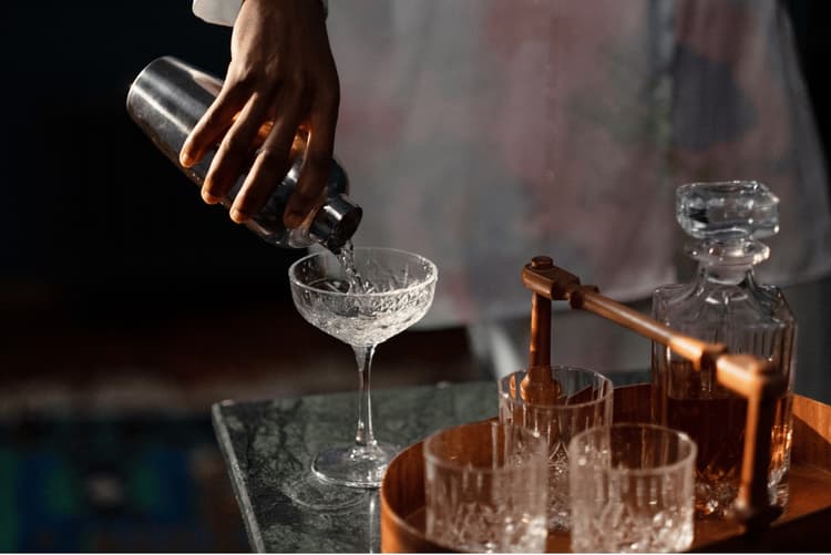 A bartender pouring a wedding cocktail